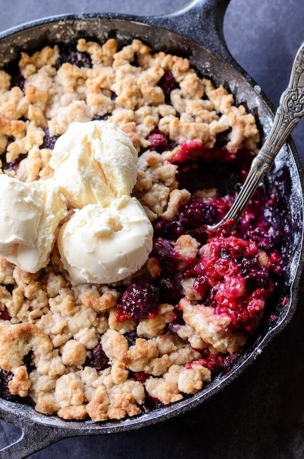 A full view of the finished berry cobbler in its baking dish